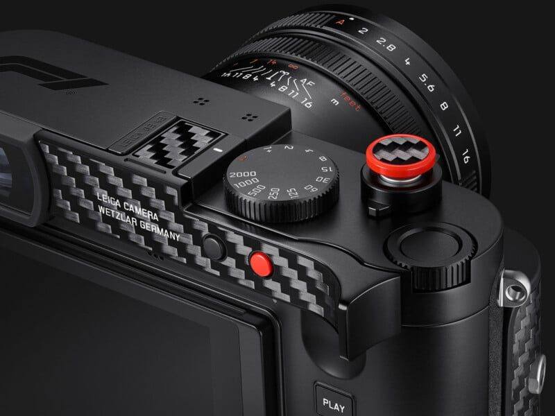 Detail of the shutter speed dial, the carbon fibre accents and the red soft release button of the Q3 43 Formula 1 Edition.