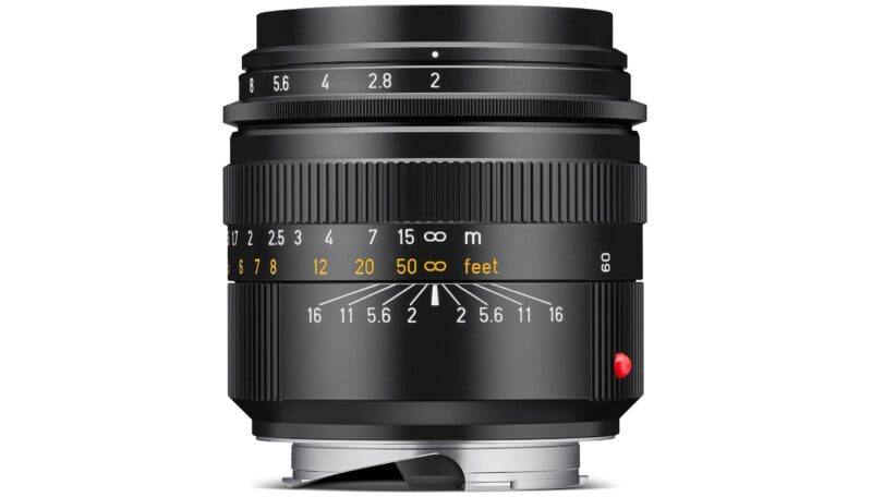 The Summicron-M 66 f/2 upright, showing the M bayonet, the red index dot and the precise focal length engraving on the side of the barrel.