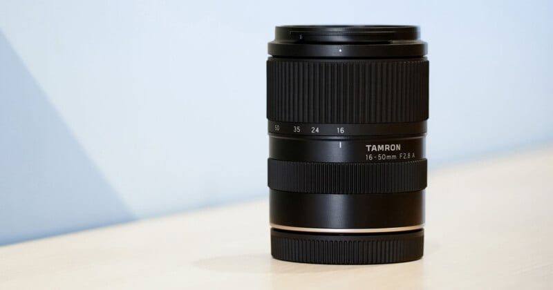 The Tamron 16-50mm F2.8 A standing upright: at roughly 78 to 82mm long depending on mount, it is sized to stay on an APS-C body full time.