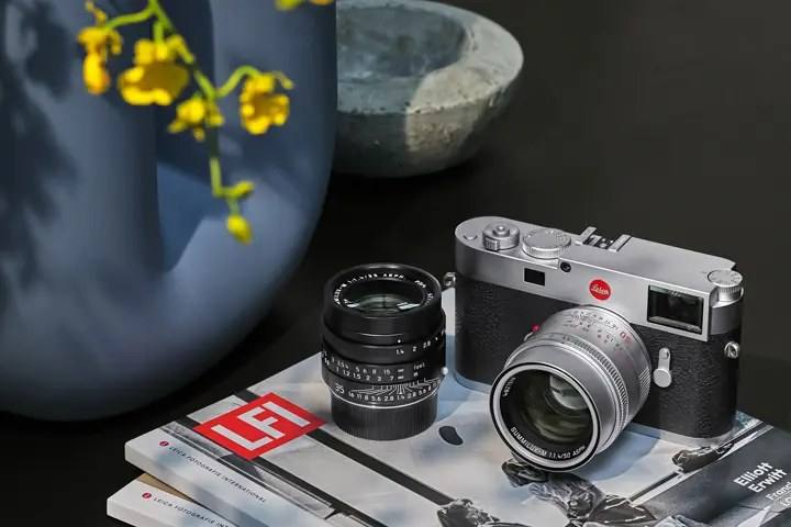 The Leica M11 in silver chrome with a Summilux-M lens, photographed for Leica's own channels.